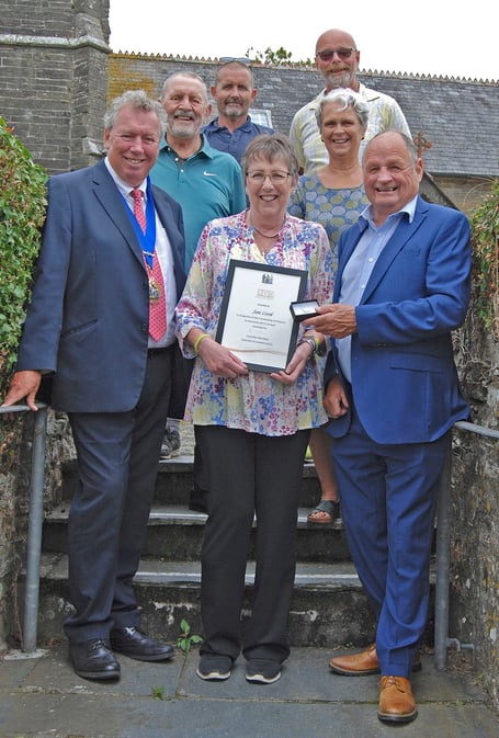 At the presentation of the Civic Award for service to the community to Jan Cook are — Front row, left to right: chair of Cornwall Council Rob Nolan, Jan Cook, Cllr Jim Candy. Middle: Paul Cook, Pelynt parish Cllr Serena Blake. Back: Pelynt parish council chair Kevin Wakeham and Pelynt parish clerk Rob Horskins