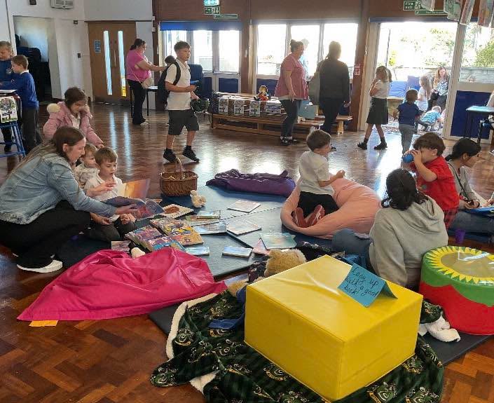 Students and parents taking part in the reading part at Brunel Primary and Nursery Academy in Saltash