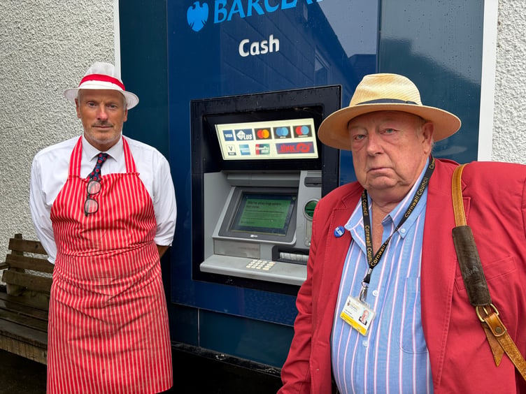 Butcher Rob Carr, left, and Cllr Pete Mitchell are among those demanding that the village's cash machine stays