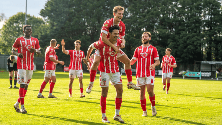 Tim Nixon is congratulated on his goal by fellow midfielder Matt Searle.