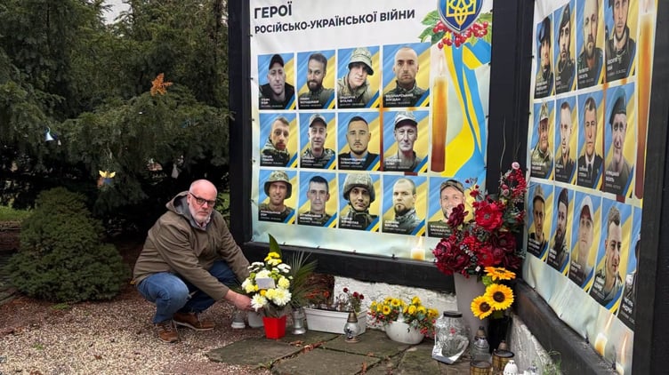 Liskeard councillor Simon Cassidy pays his respect to the fallen soldiers in the Ukraine