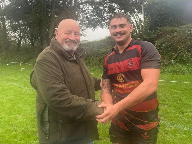 Man-of-the-match Adam Dack was presented his award by club president Chris Hocking.